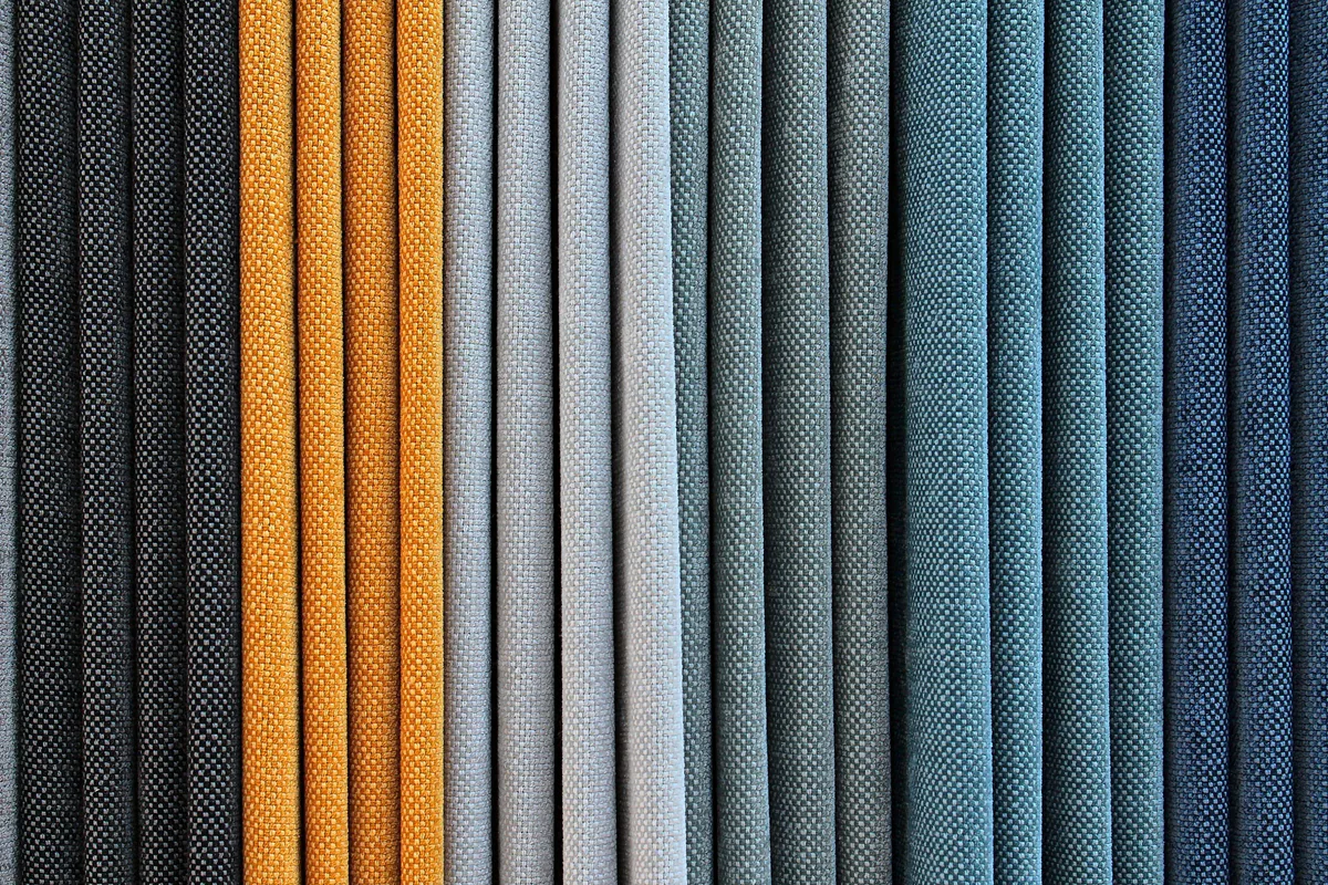 Woven fabric samples in gold, grey and blue